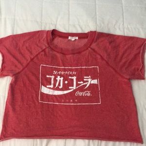 Never worn, red, coca-cola shirt.